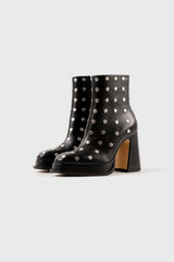 CHUECA - Bottes à semelle compensée en cuir noir cloutées