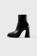 CHUECA - Bottes à semelles compensées en cuir noir