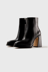 CHUECA - Bottes à semelles compensées en cuir noir