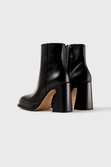 CHUECA - Bottes à semelles compensées en cuir noir
